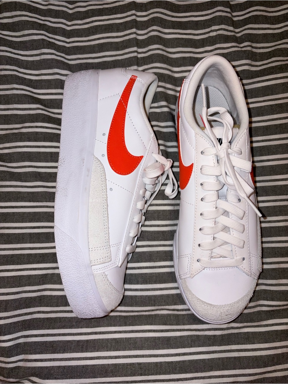 Nike Women's White Low-Top Sneakers with Bright Orange Swoosh